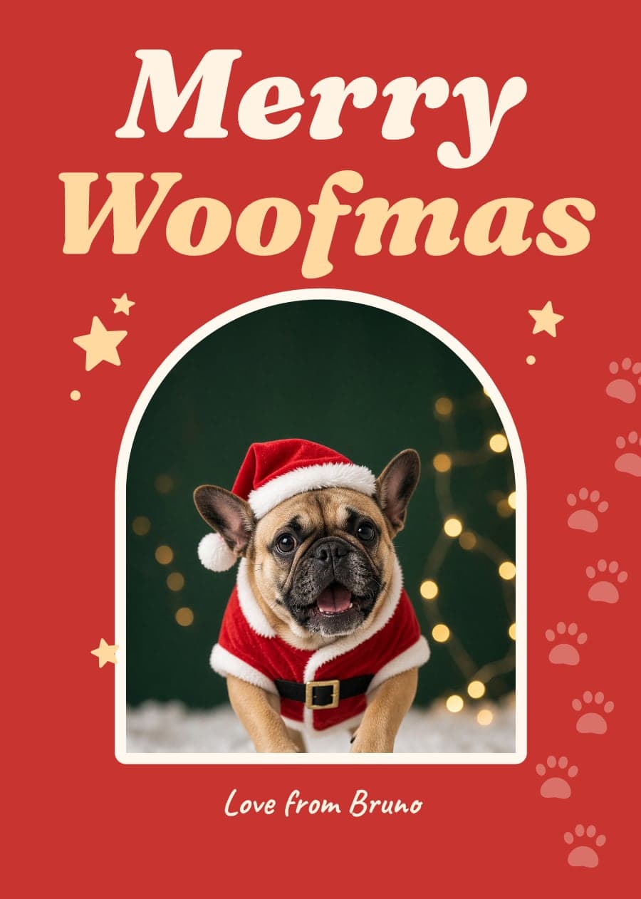 A red card saying Merry Woofmas with a French Bulldog dressed as Santa